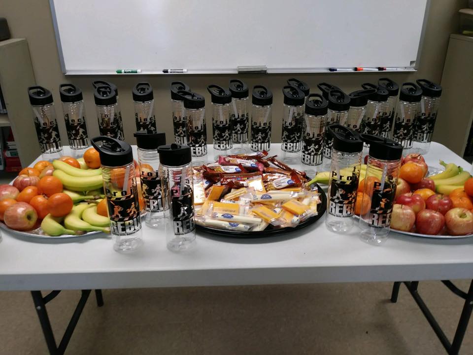 Customer photo from Joanna of our Clear Impact Halcyon Water Bottle with Flip Straw Lid - 24 oz, a table with fruit and snacks on it