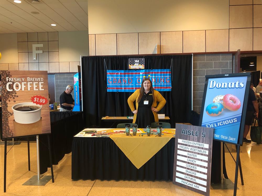 Customer photo from Kelsey of our Mega Vortex Tumbler - 16 oz, a woman standing behind a table