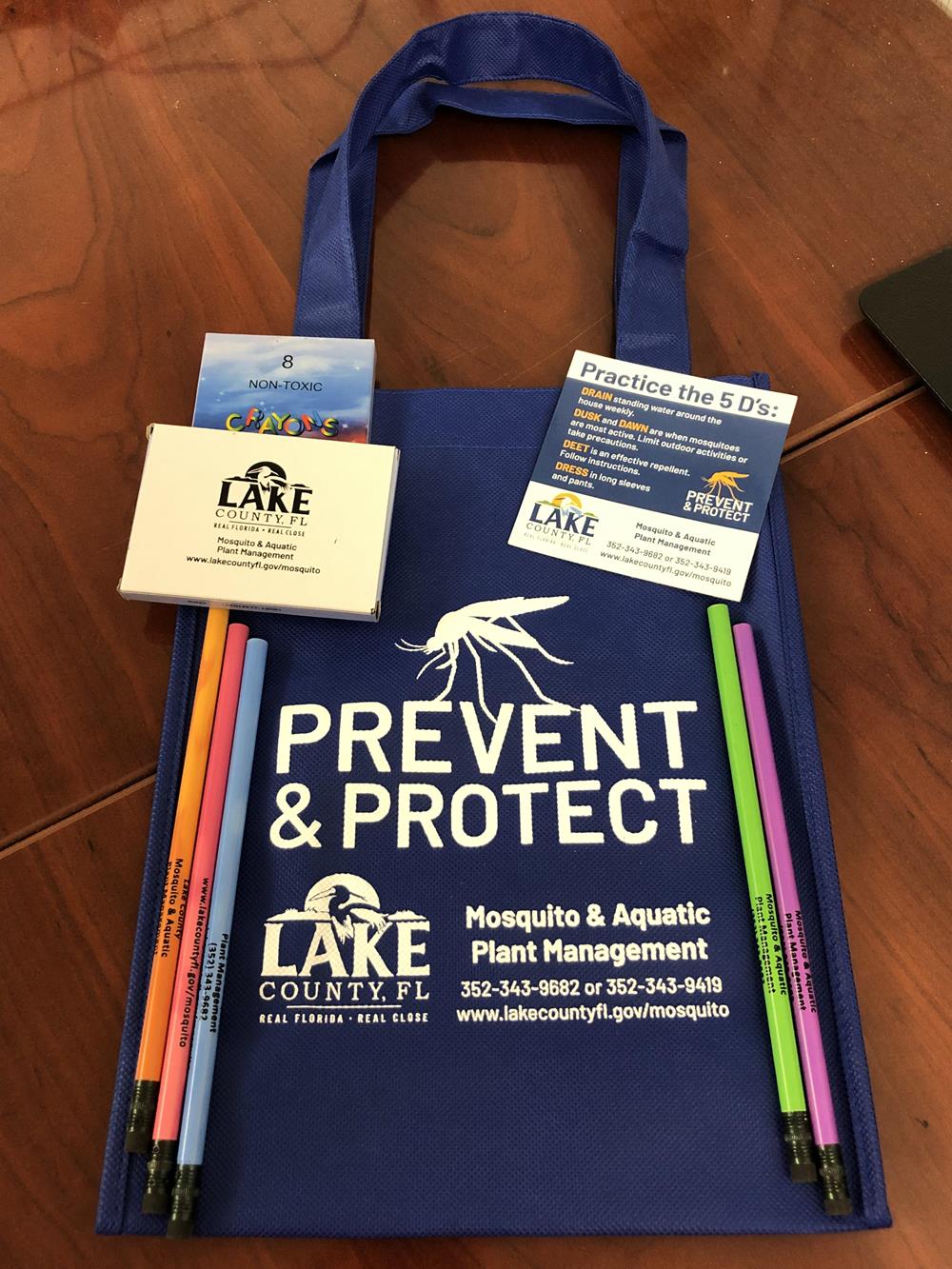 Customer photo from Tony of our Crayon 8-Pack, a blue bag with colorful pencils and a white text on it