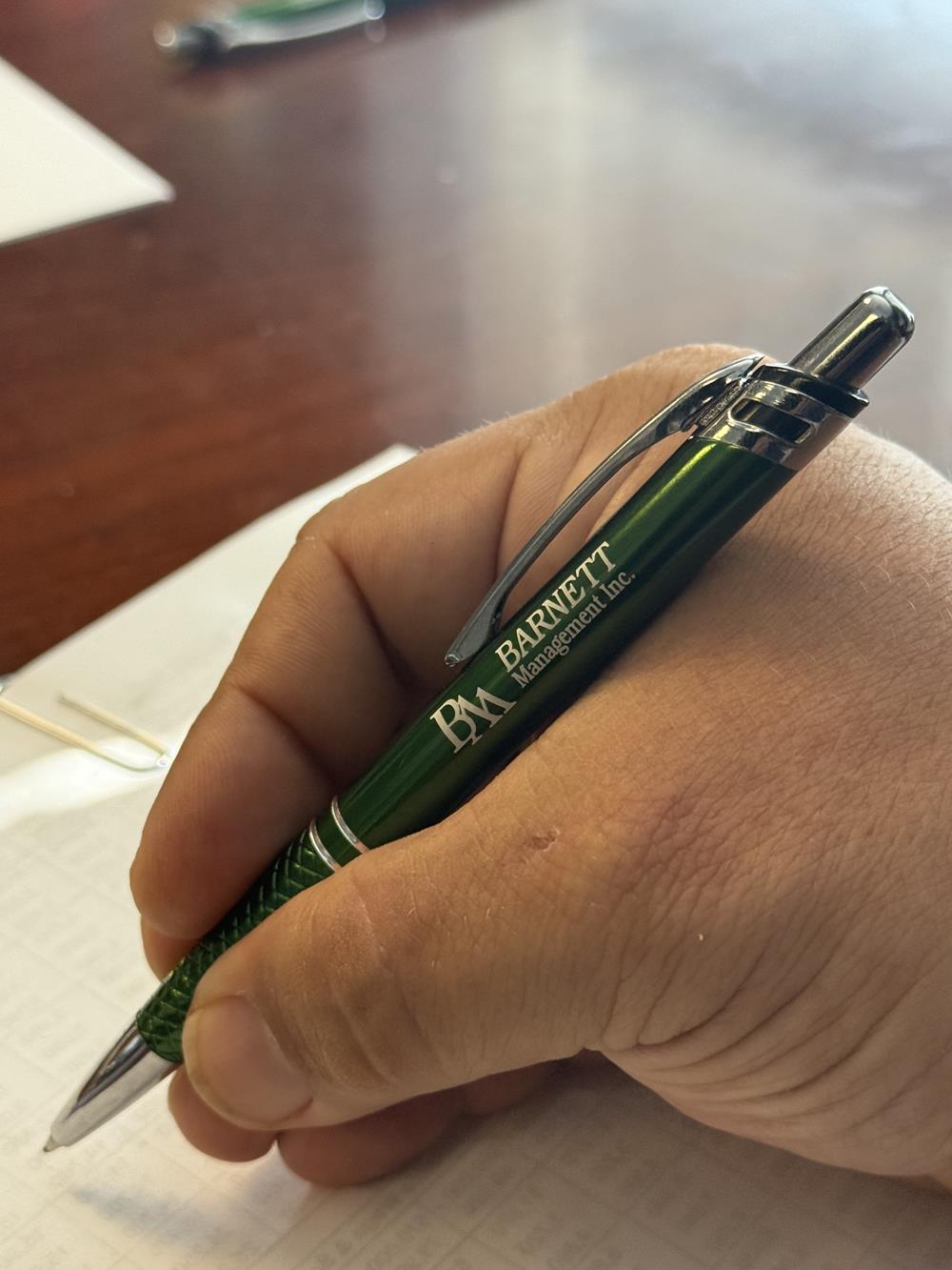 Customer photo from David of our Extreme EDRY Interlock Polo - Men's, a hand holding a pen