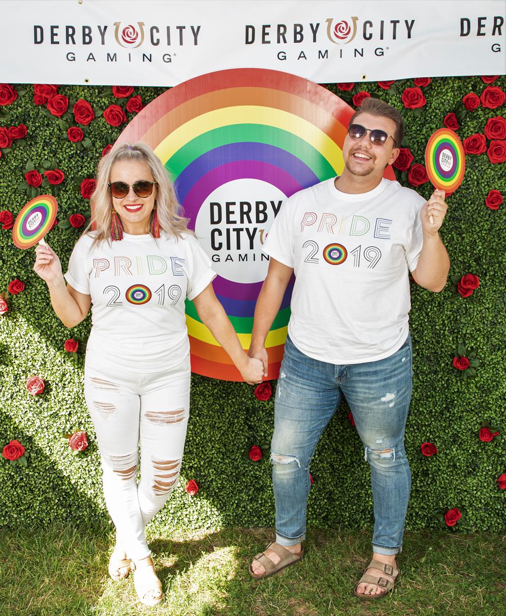 Customer photo from Kayla of our Hanes Authentic T-Shirt - Full Color - White, a man and woman holding hands in front of a rainbow sign