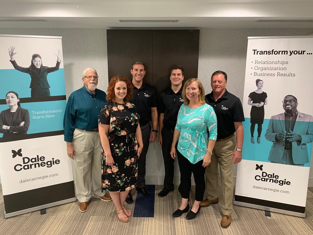 Customer photo from Brandin of our Ideal Retractable Banner Display - 31-1/2", a group of people posing for a photo