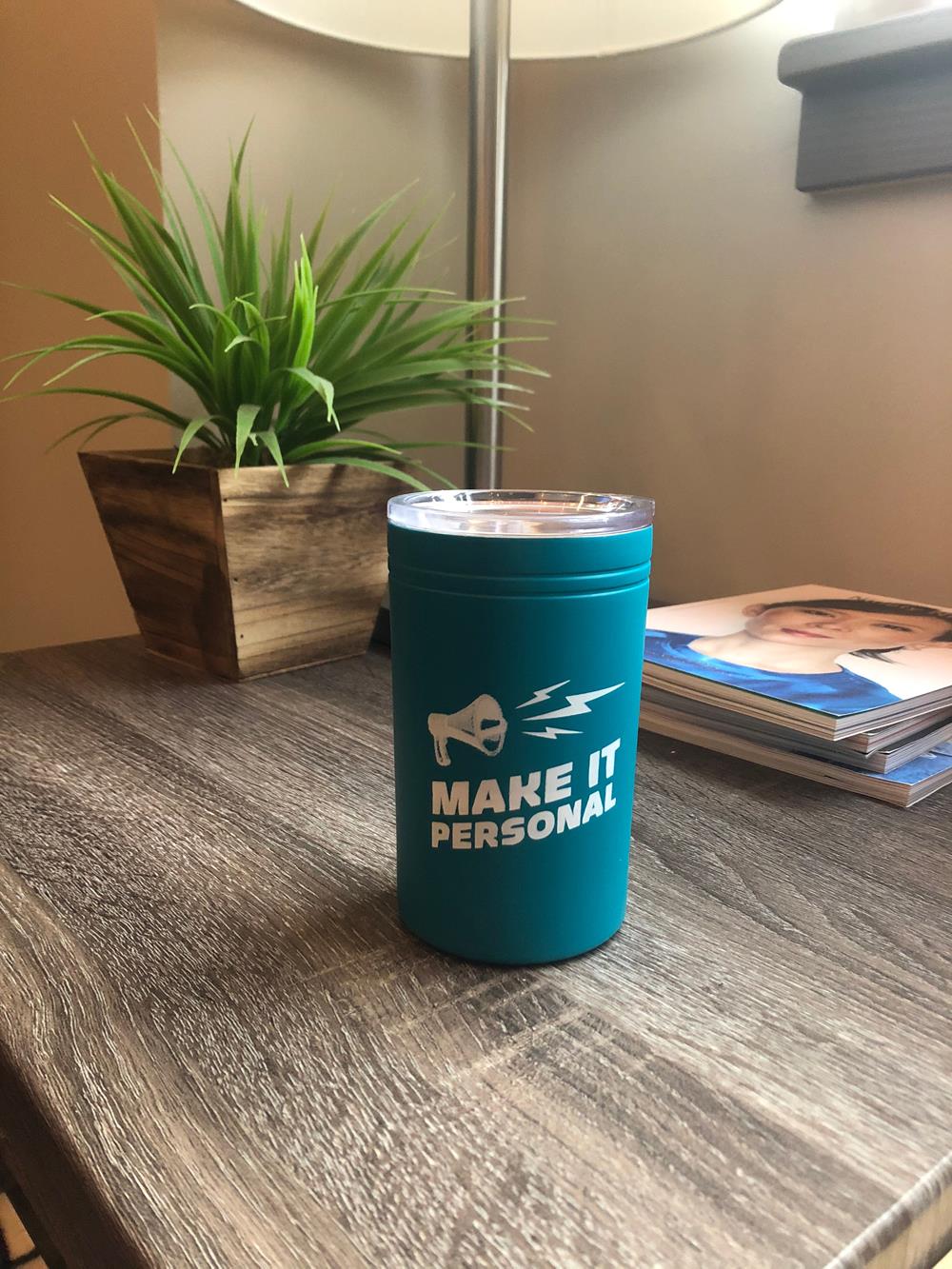 Customer photo from Emily of our Sherpa Vacuum Travel Tumbler and Insulator - 11 oz., a blue cup on a table