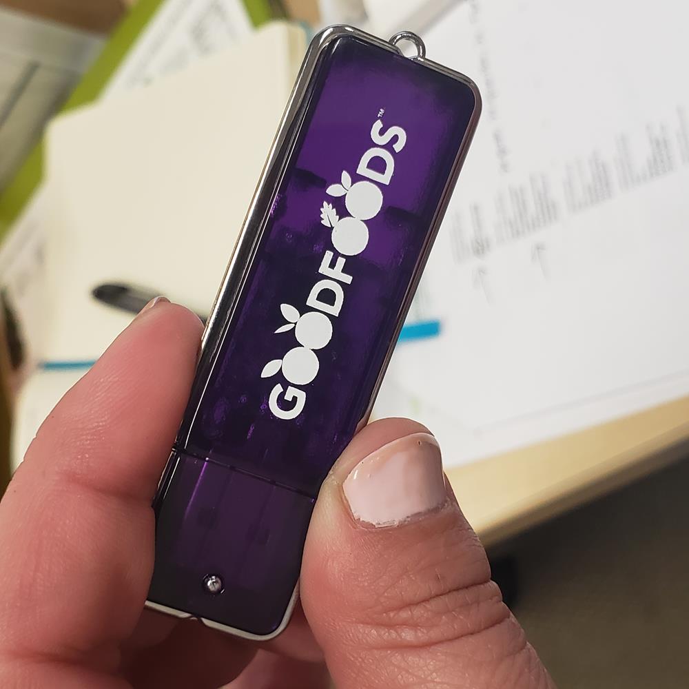 Customer photo from Mandy of our Square-off USB Flash Drive - 4GB - 24 hr, a hand holding a usb flash drive