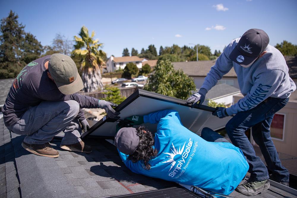 Customer photo from Sean of our Adult 5.2 oz. Cotton Long Sleeve T-Shirt - Screen, a group of people working on a roof