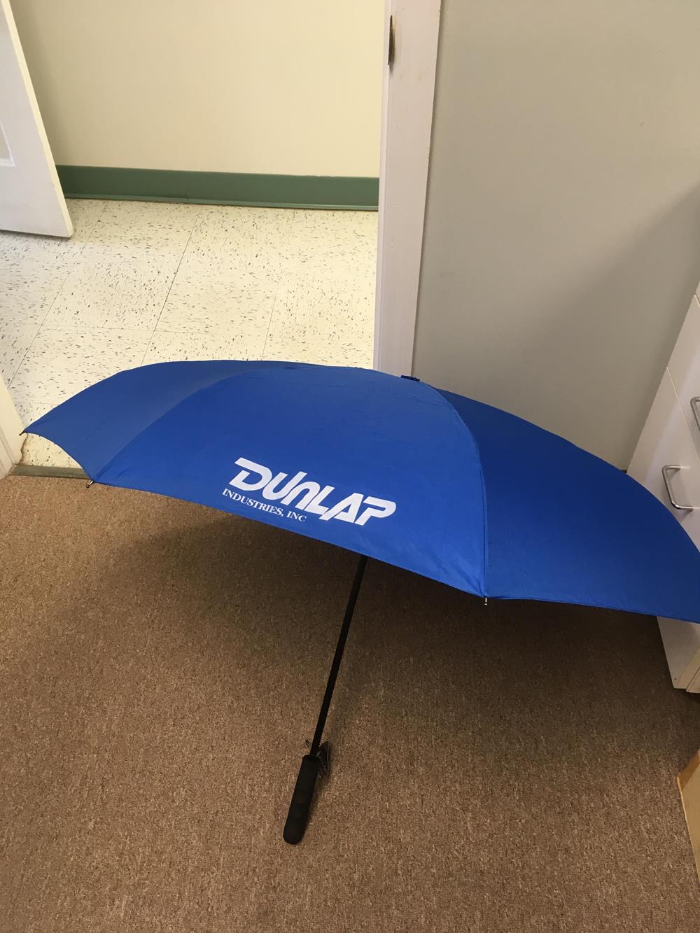 a blue umbrella on the floor