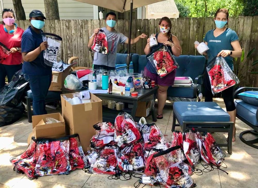 Customer photo from Melissa of our Clear Sportpack - 17" x 14", a group of people holding bags of items