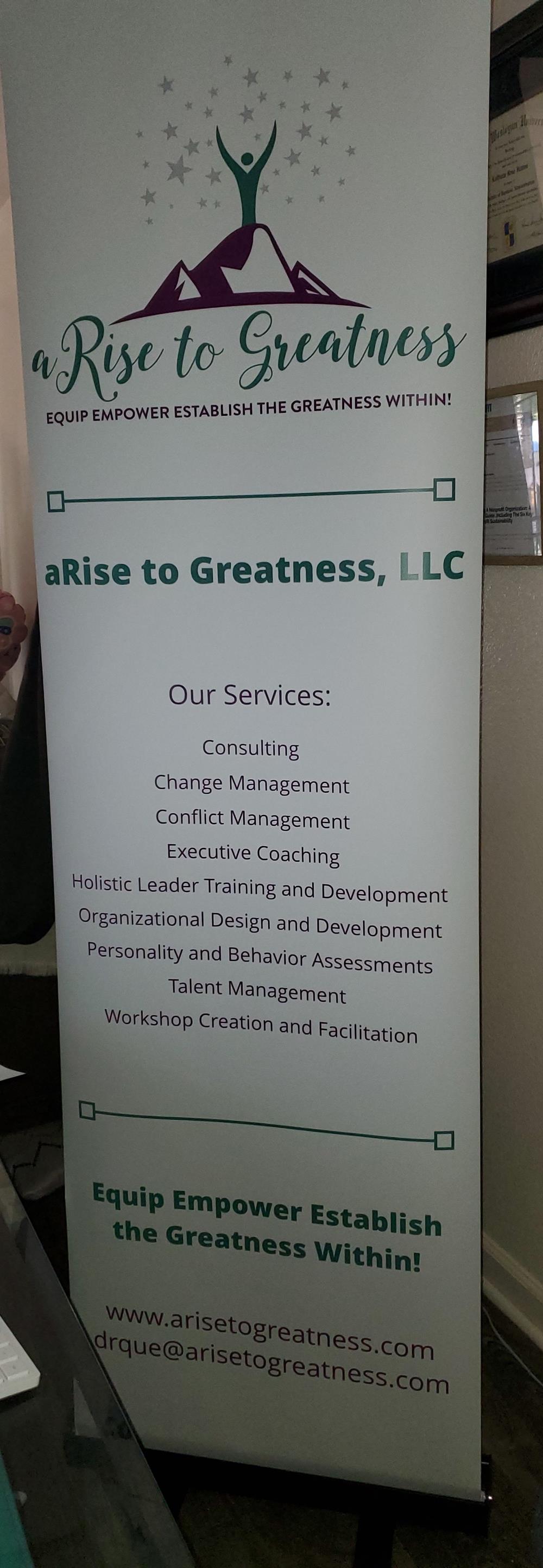 Customer photo from LaQueta of our Economy Retractable Banner Display - 24", a sign with text on it