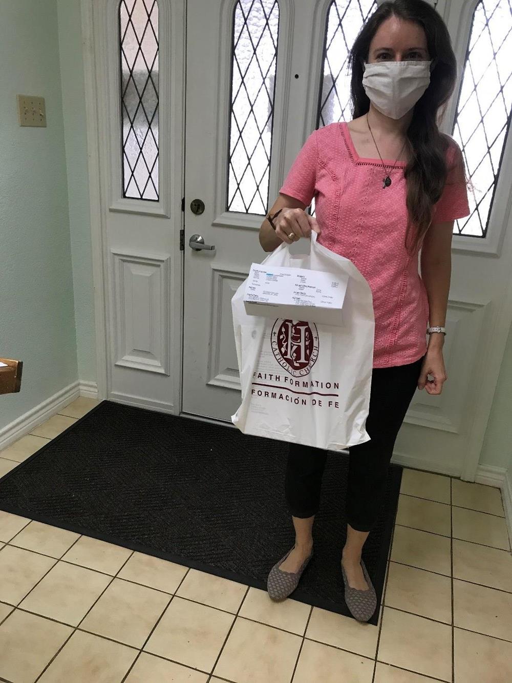 Customer photo from Lilia of our Convention Bag - 19" x 15", a woman wearing a face mask holding a bag