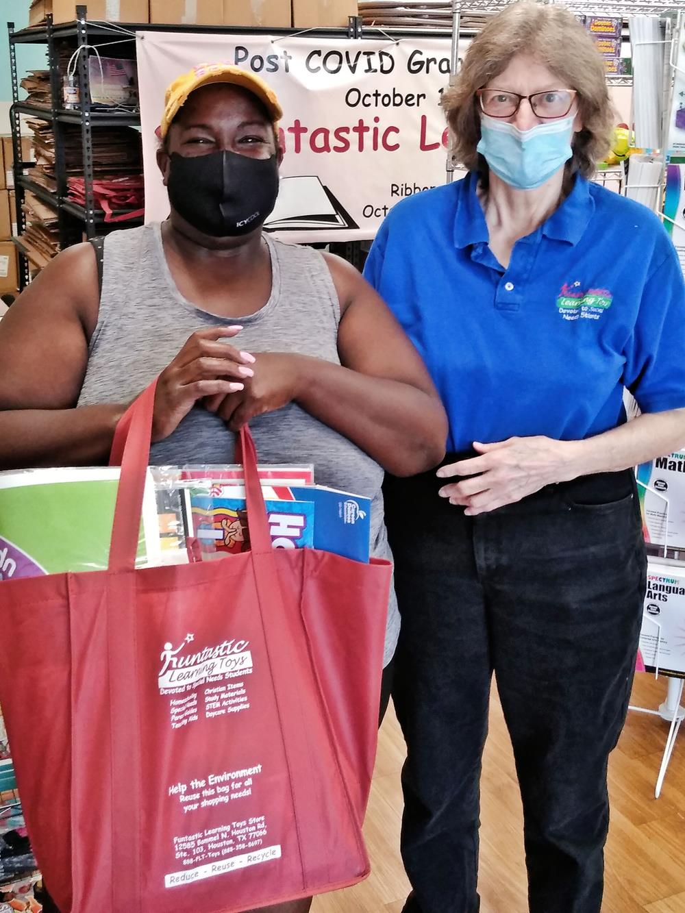 Customer photo from Jeff of our Value Grocery Tote - 15 inches x 13 inches - 24 hr, a woman wearing a face mask and a woman wearing a face mask