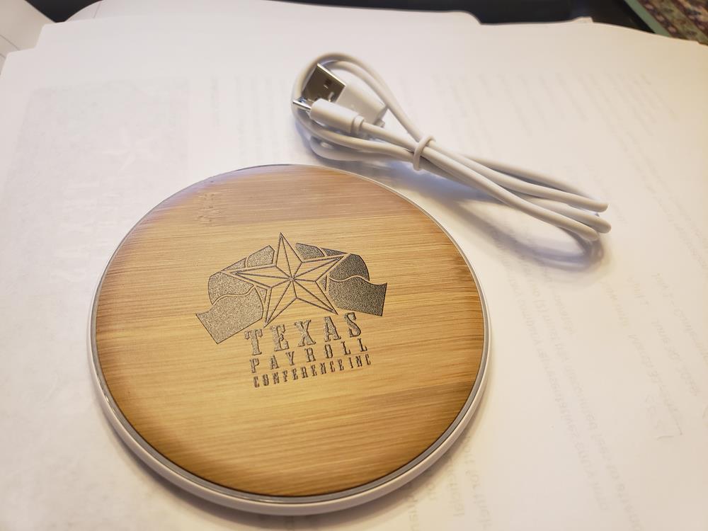 Customer photo from Shantale of our Natural Wood Grain Wireless Charger, a charger on a paper