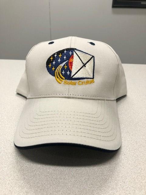 Customer photo from Sheryl of our Elite Cap - Embroidered, a white hat with a logo on it