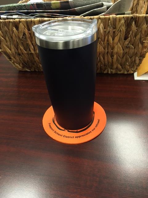 Customer photo from Stacey of our Cushioned Jar Opener - Circle, a black and silver tumbler on a coaster