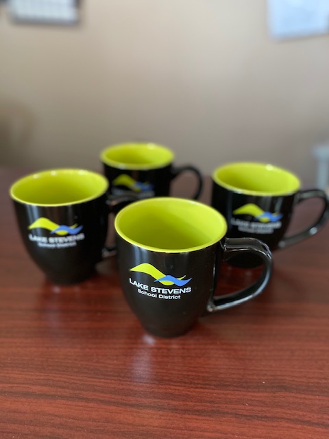 Customer photo from Kim of our Zapata Bistro Ceramic Mug - 14 oz., a group of black coffee mugs with yellow rims