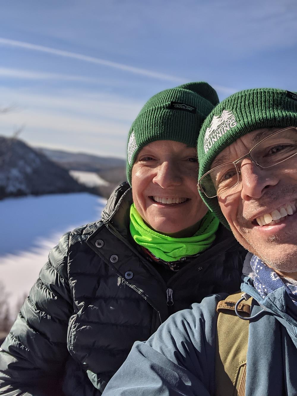 Customer photo from Jeff of our Crossland Cuff Beanie - 24 hr, a man and woman taking a selfie in the snow