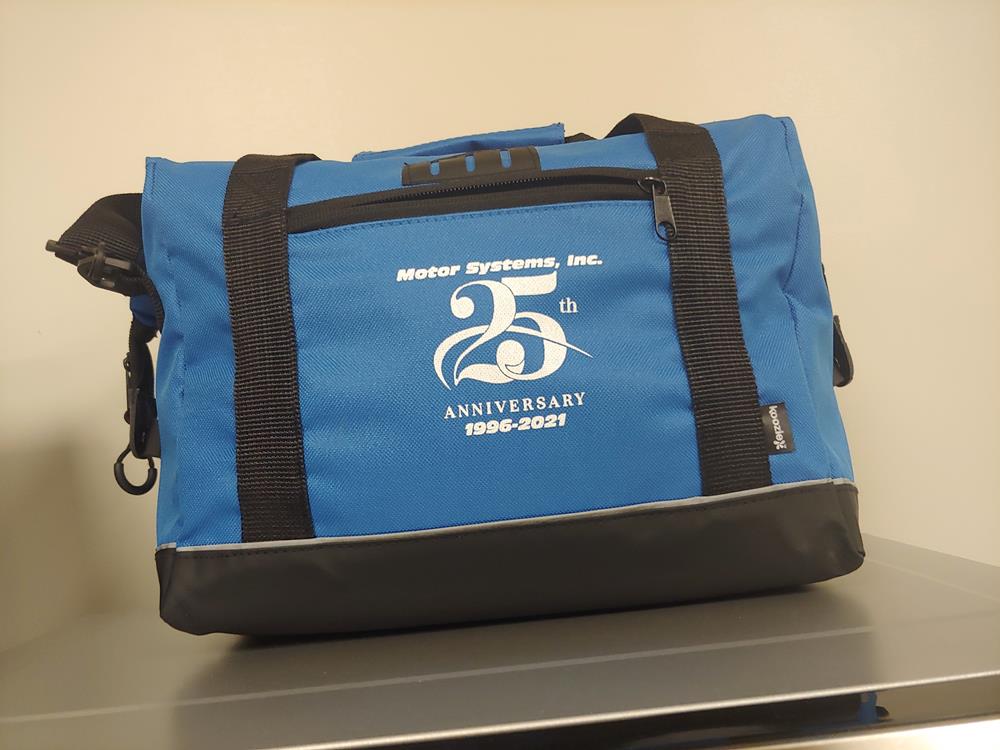 Customer photo from Trish of our Koozie® Rogue 12-Pack Cooler, a blue bag with a black strap