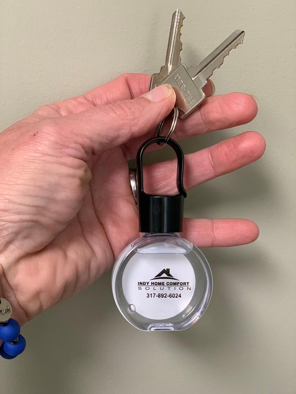 Customer photo from Angila of our Link Hand Sanitizer - 1 oz., a hand holding a key chain