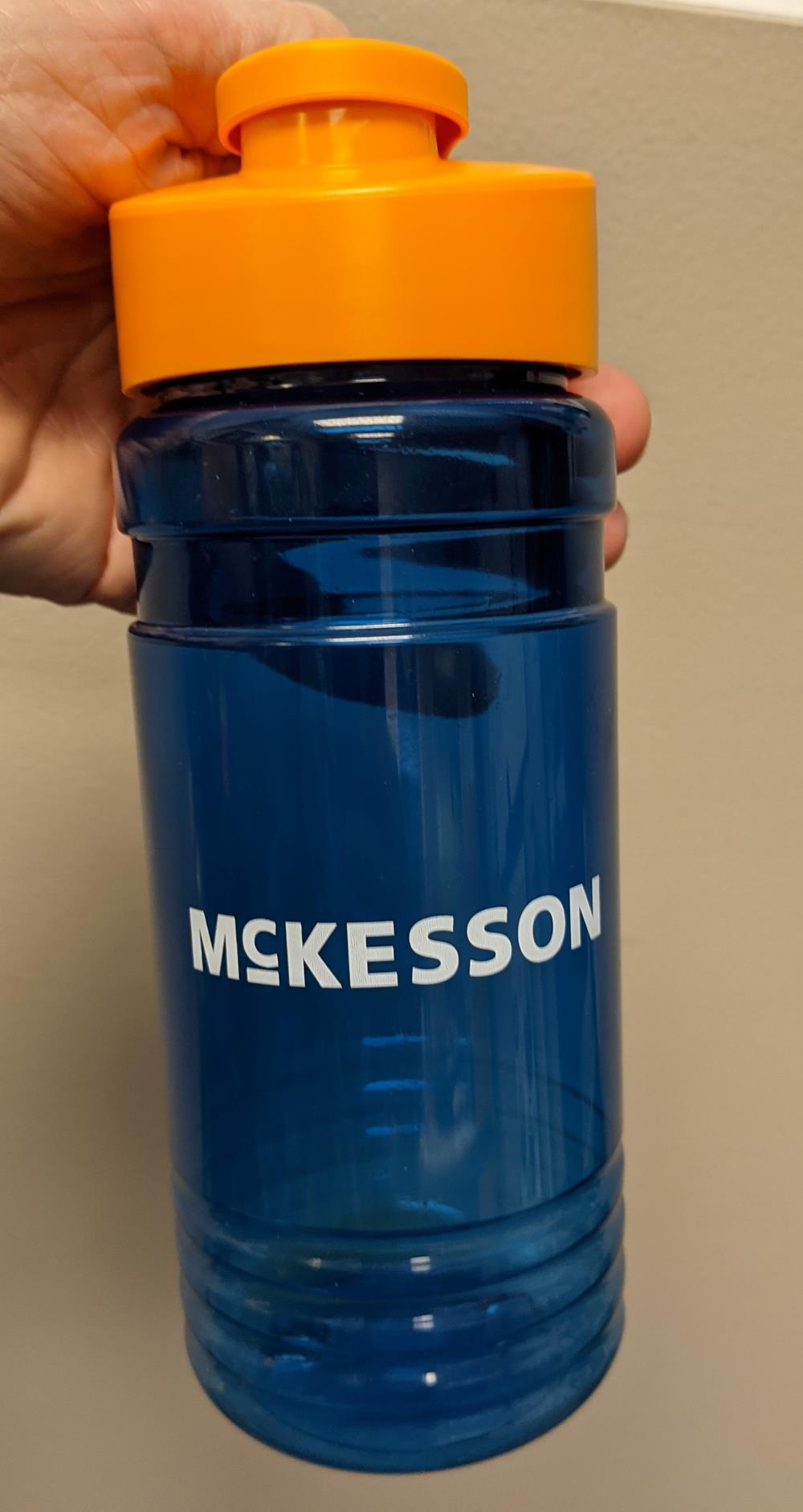 a blue water bottle with a yellow cap