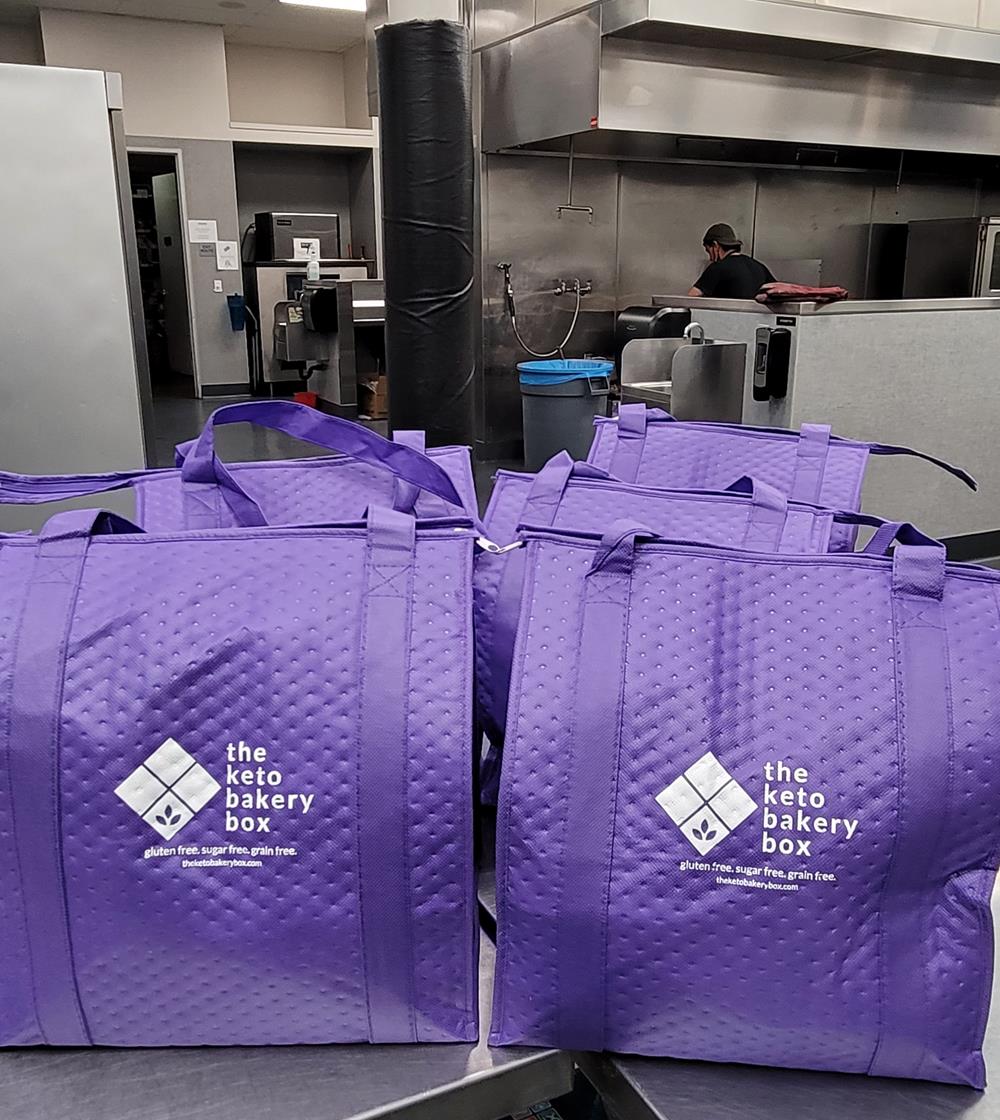 a group of purple bags in a kitchen