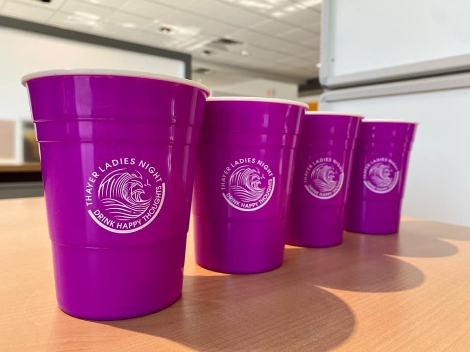 a group of purple plastic cups
