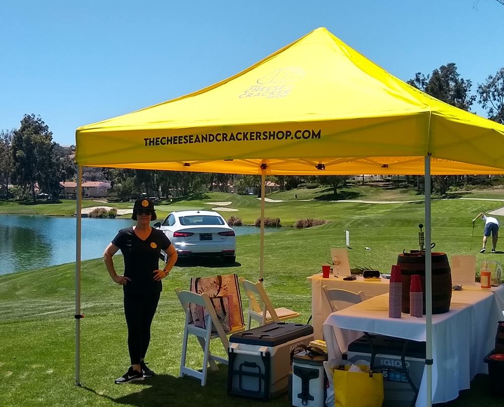 Customer photo from Bryan of our Standard 10' Event Tent, a woman standing in front of a tent