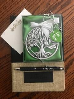 Customer photo from Charlene of our Souvenir Sticky Note - 3 inches x 4 inches - 25 Sheet, a pen and notebook on a table