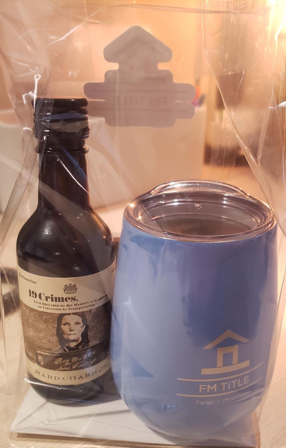 a bottle and a mug in a plastic bag