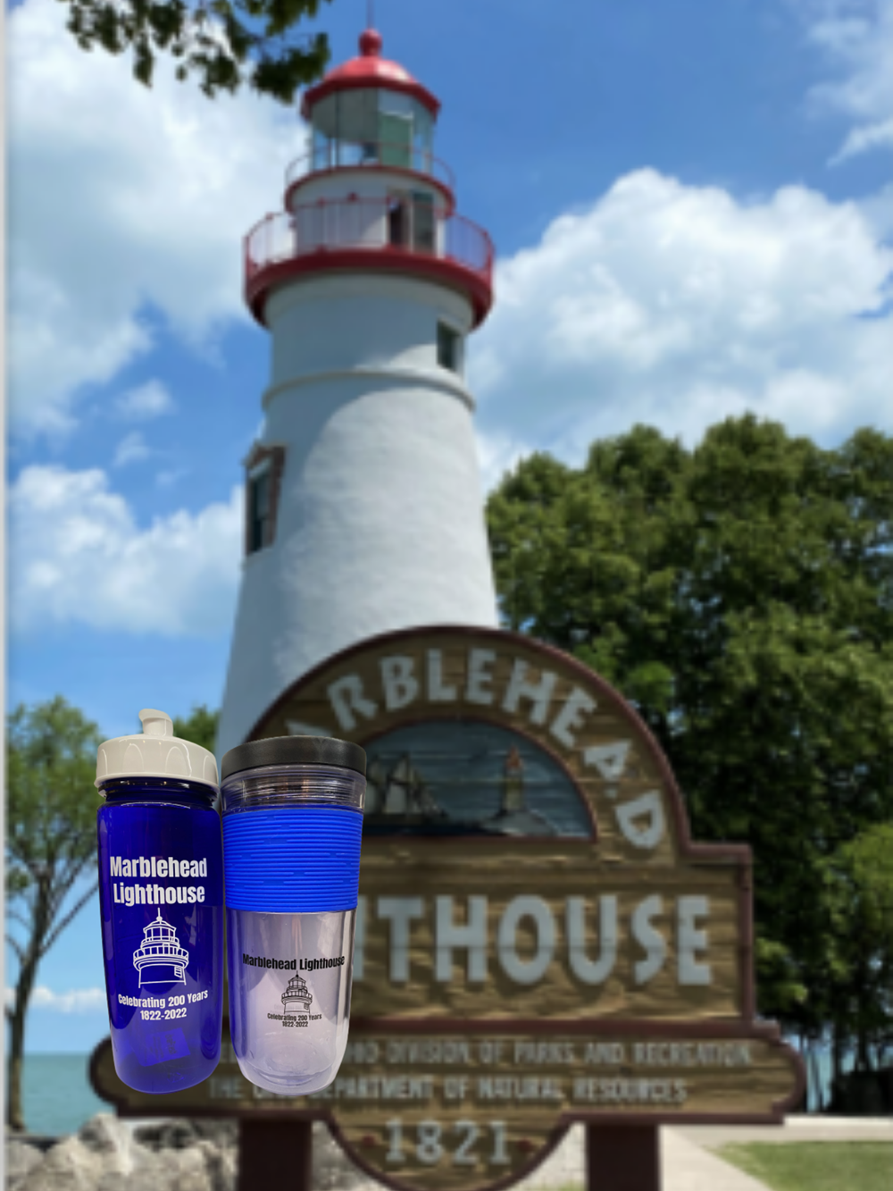 Customer photo from Susan of our Wolverine Pen, a lighthouse with a blue water bottle and a blue water bottle