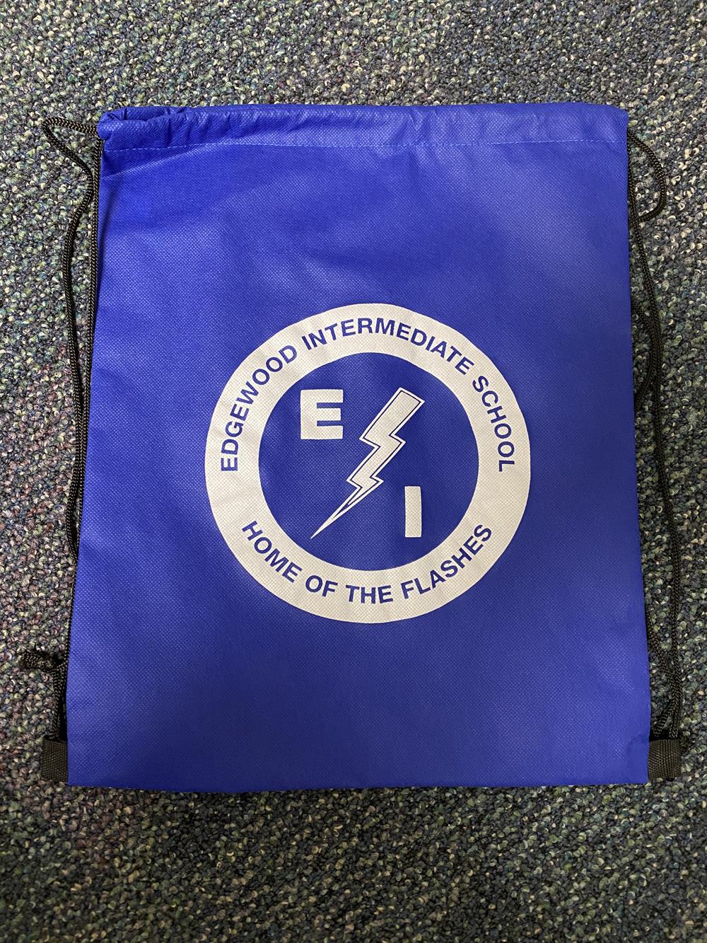 Customer photo from Jennifer of our Promotional Drawstring Sportpack, a blue drawstring bag with white text on it