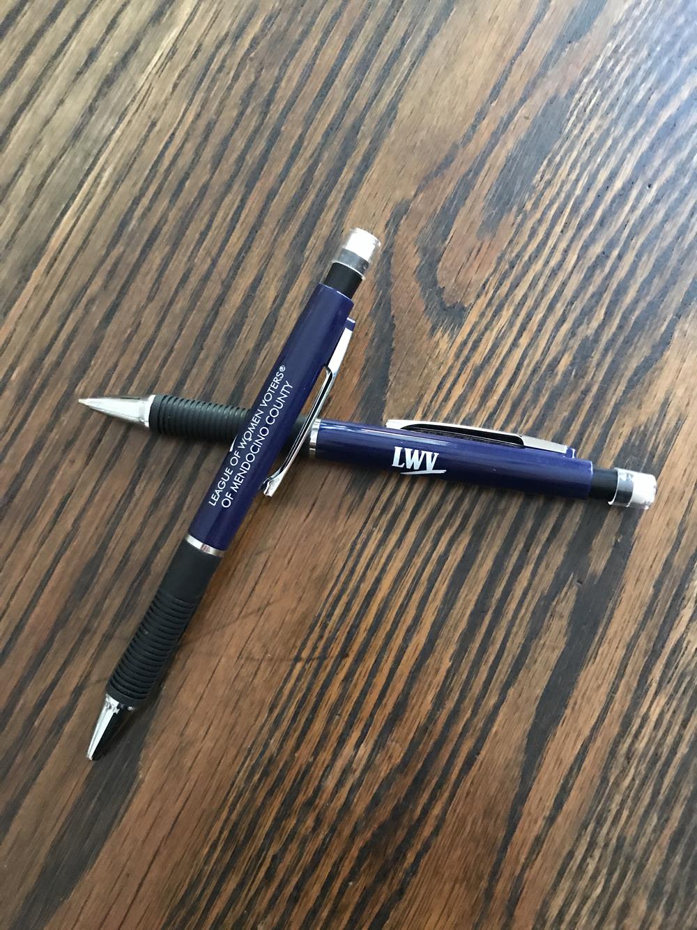 two pens on a table