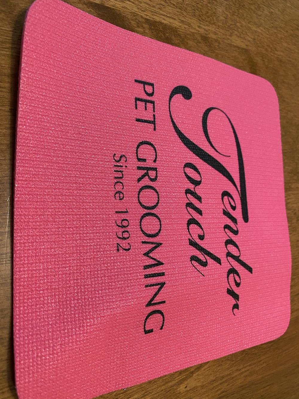 a pink mat with black text on it
