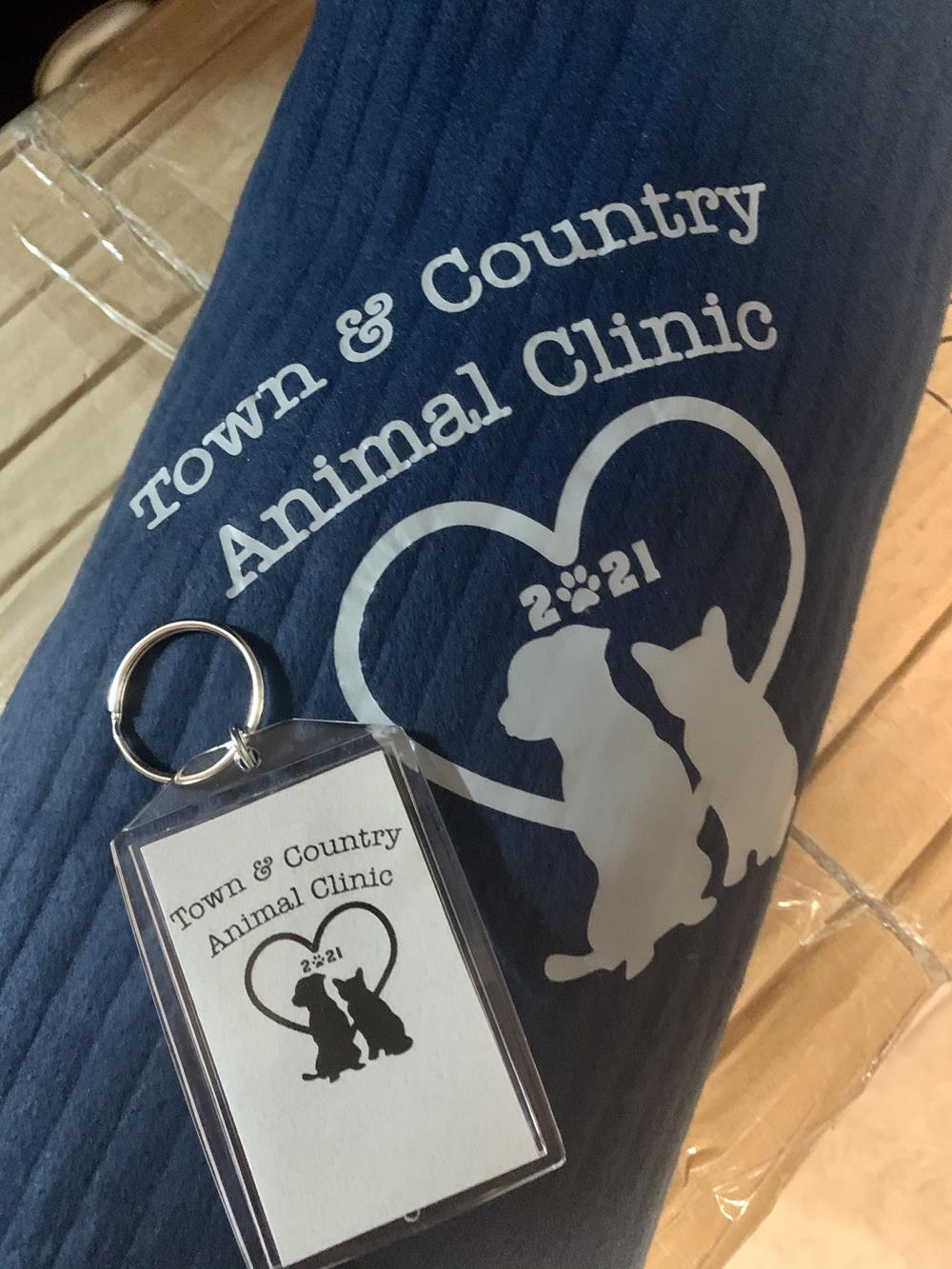 Customer photo from Deidre of our Ribbed Fleece Blanket, a key chain on a towel