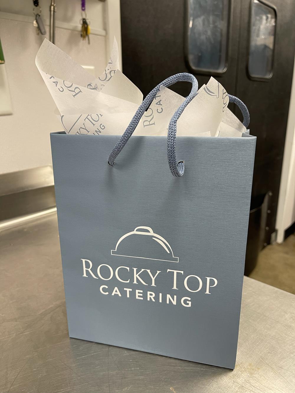 a blue bag with white text and white text on it