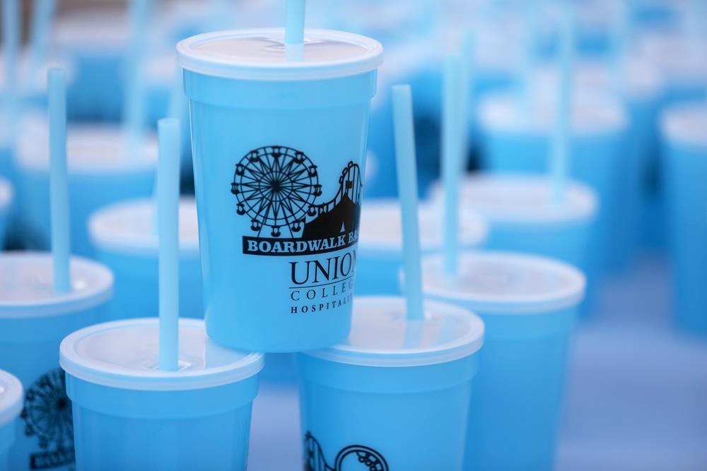 a group of blue cups with straws