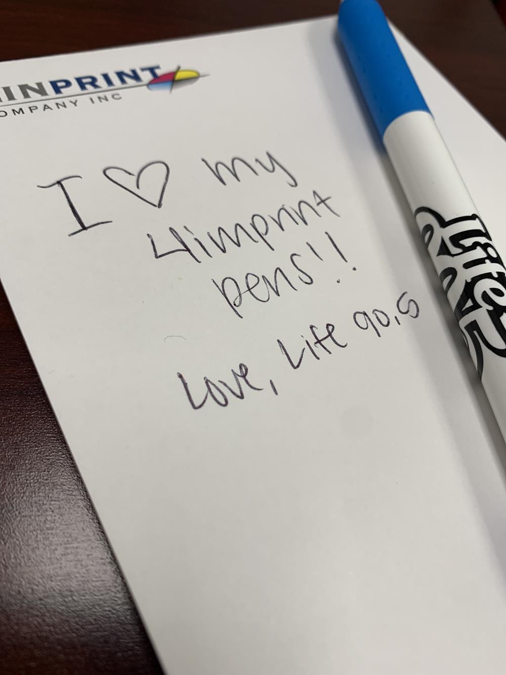 Customer photo from Samantha of our Alamo Pen - White - Opaque, a notepad with a pen on a table