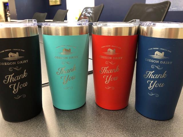 Customer photo from Nancy of our Yowie Vacuum Tumbler - 18 oz. - Powder Coat - Laser Engraved, a group of cups on a table