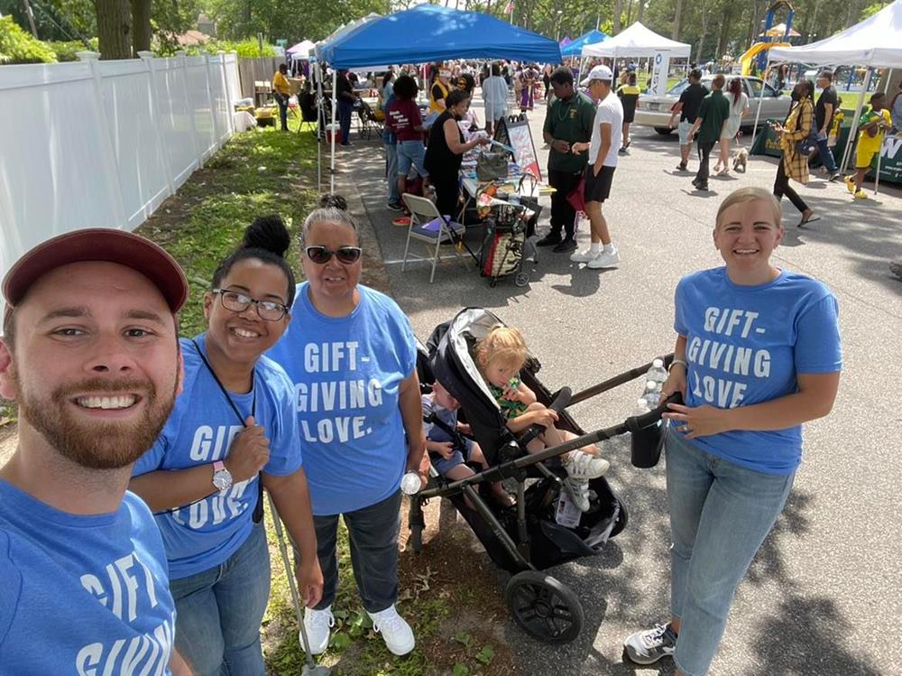 Customer photo from Tim of our Gildan Softstyle T-Shirt - Men's - Colors - Screen, a group of people posing for a photo
