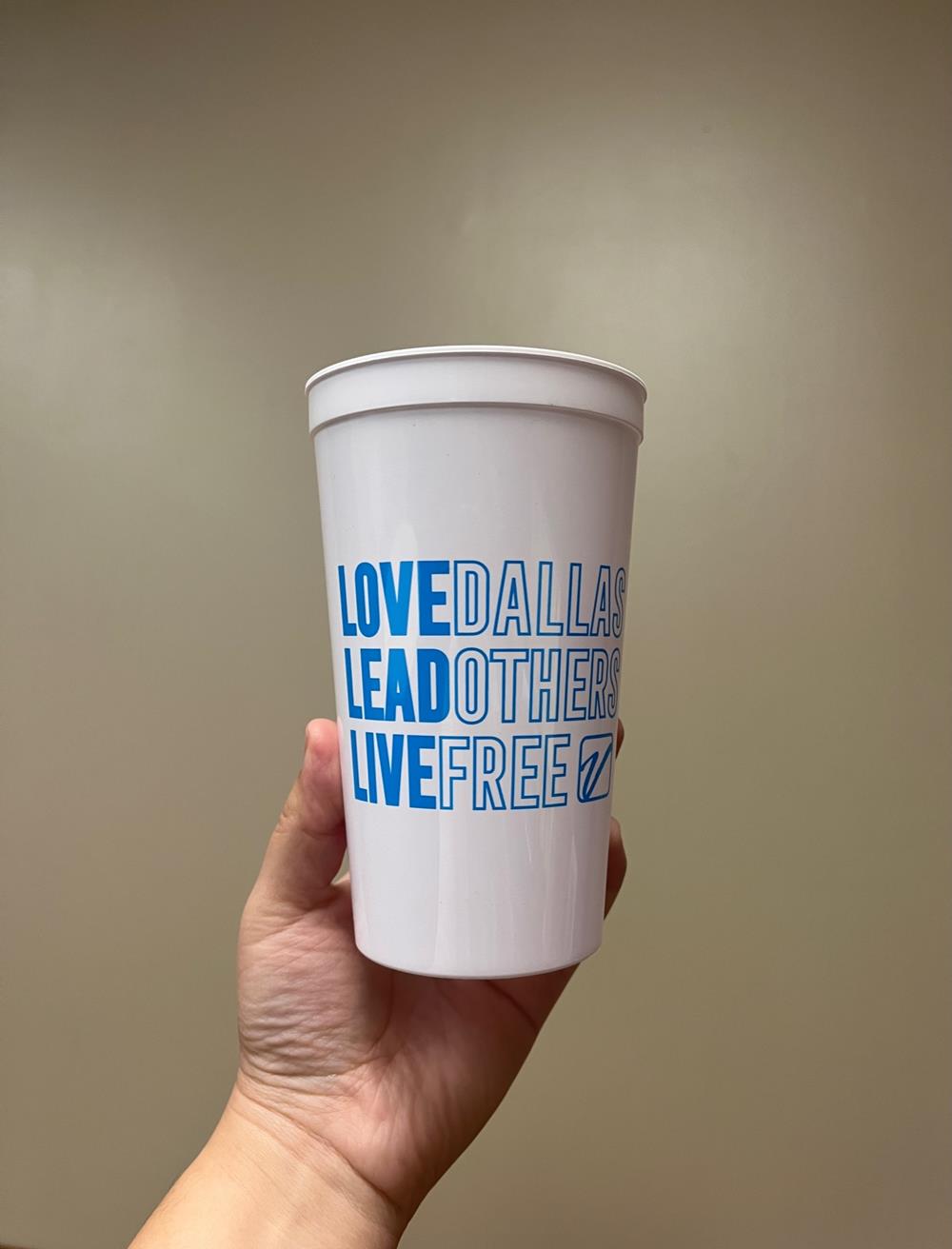 Customer photo from Bianca of our Event Stadium Cup - 20 oz., a hand holding a white cup
