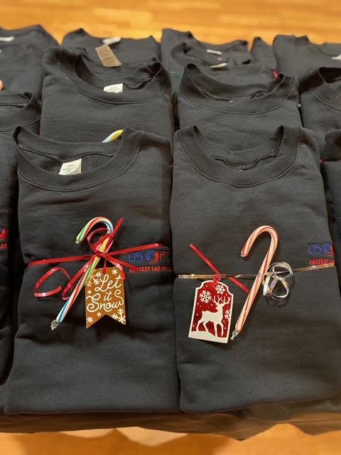 Customer photo from Mindy of our Hanes ComfortBlend Sweatshirt - Embroidered, a group of black shirts with candy canes