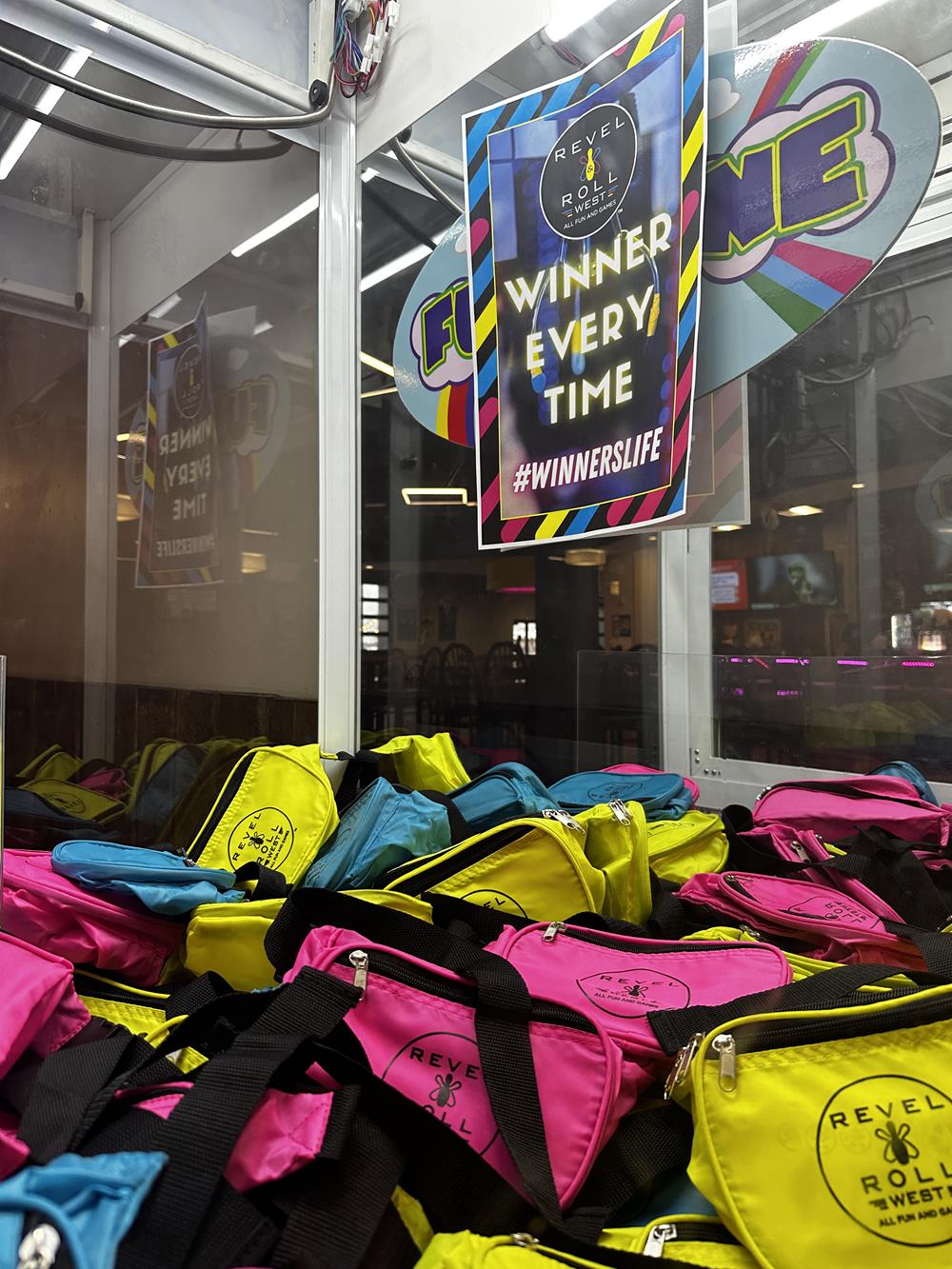 Customer photo from Ty of our Neon Fanny Pack, a group of bags in a store
