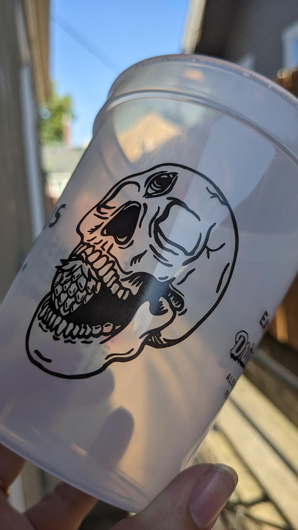 Customer photo from Mashall of our Translucent Stadium Cup - 16 oz., a white cup with a skull on it