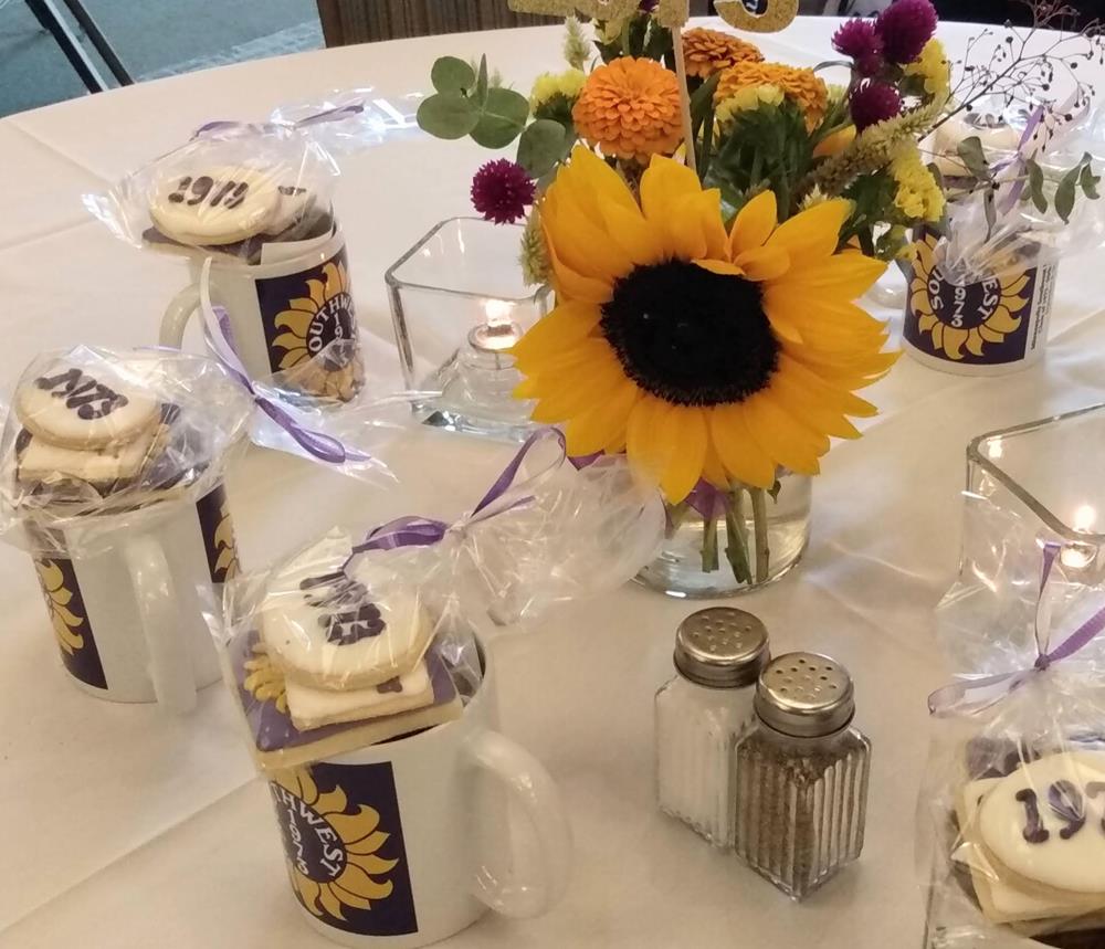 Customer photo from Luisa of our Value White Coffee Mug - 11 oz. - Full Color, a table with a sunflower and cookies