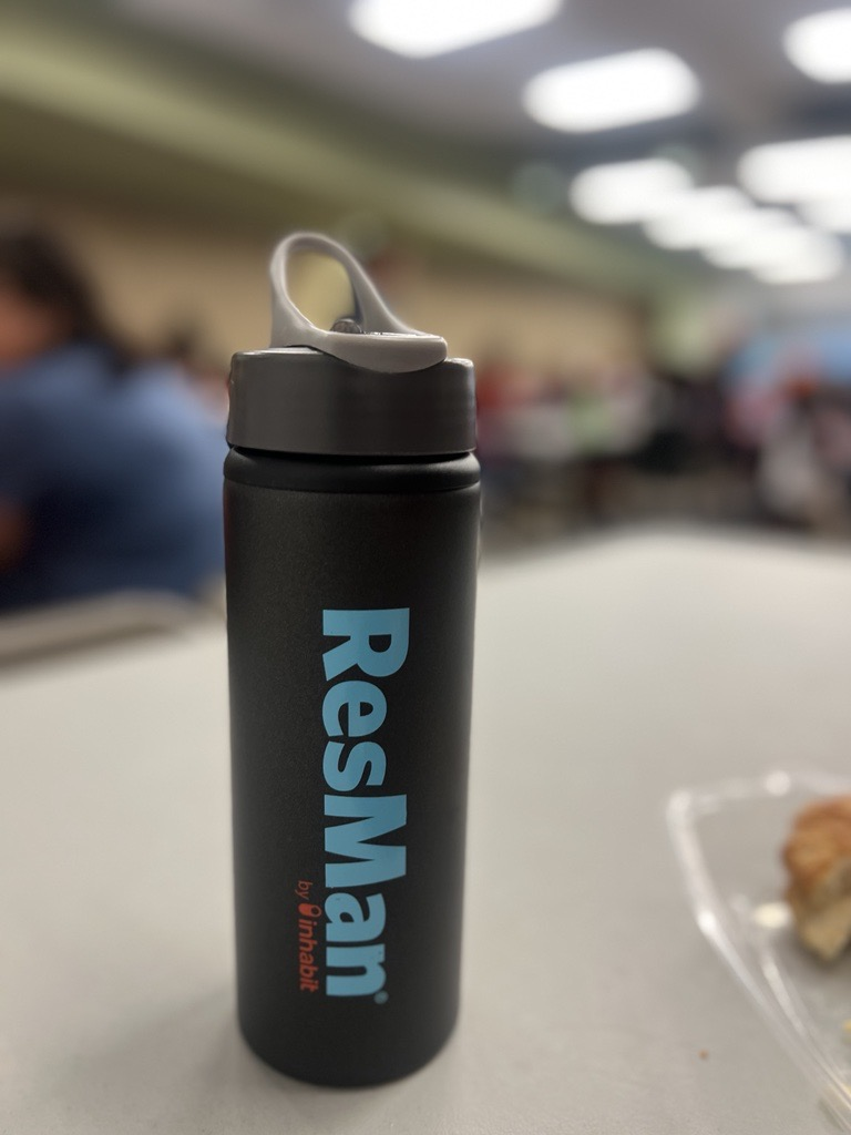 Customer photo from Earl of our Sip & Flip Aluminum Bottle - 24 ounces, a black water bottle on a table