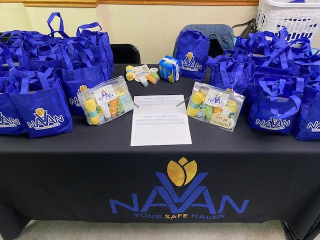 Customer photo from Anissa of our Spree Shopping Tote - 13" x 13" - Full Color, a table with blue bags and a paper on it