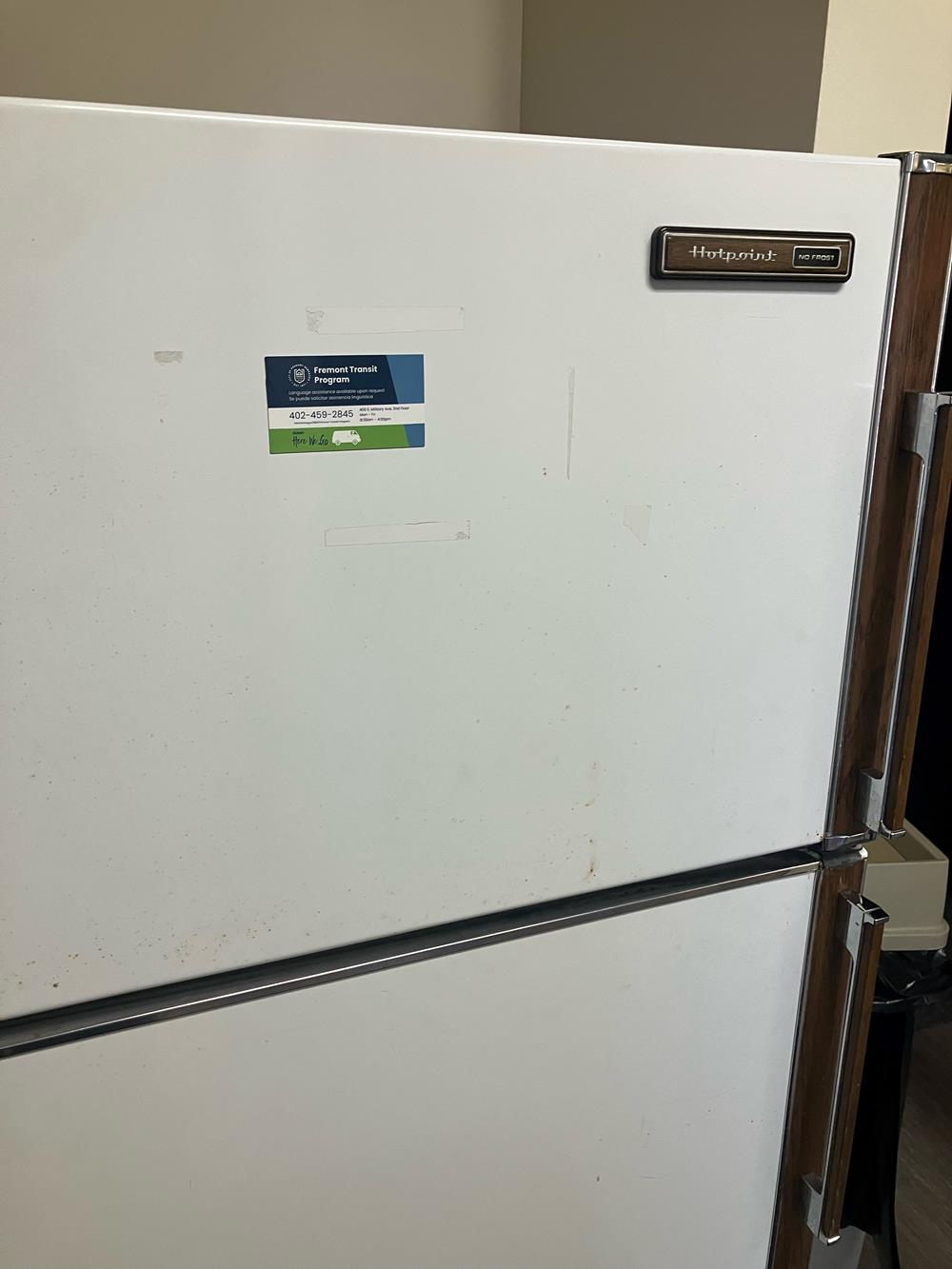 a white refrigerator with a sticker on it