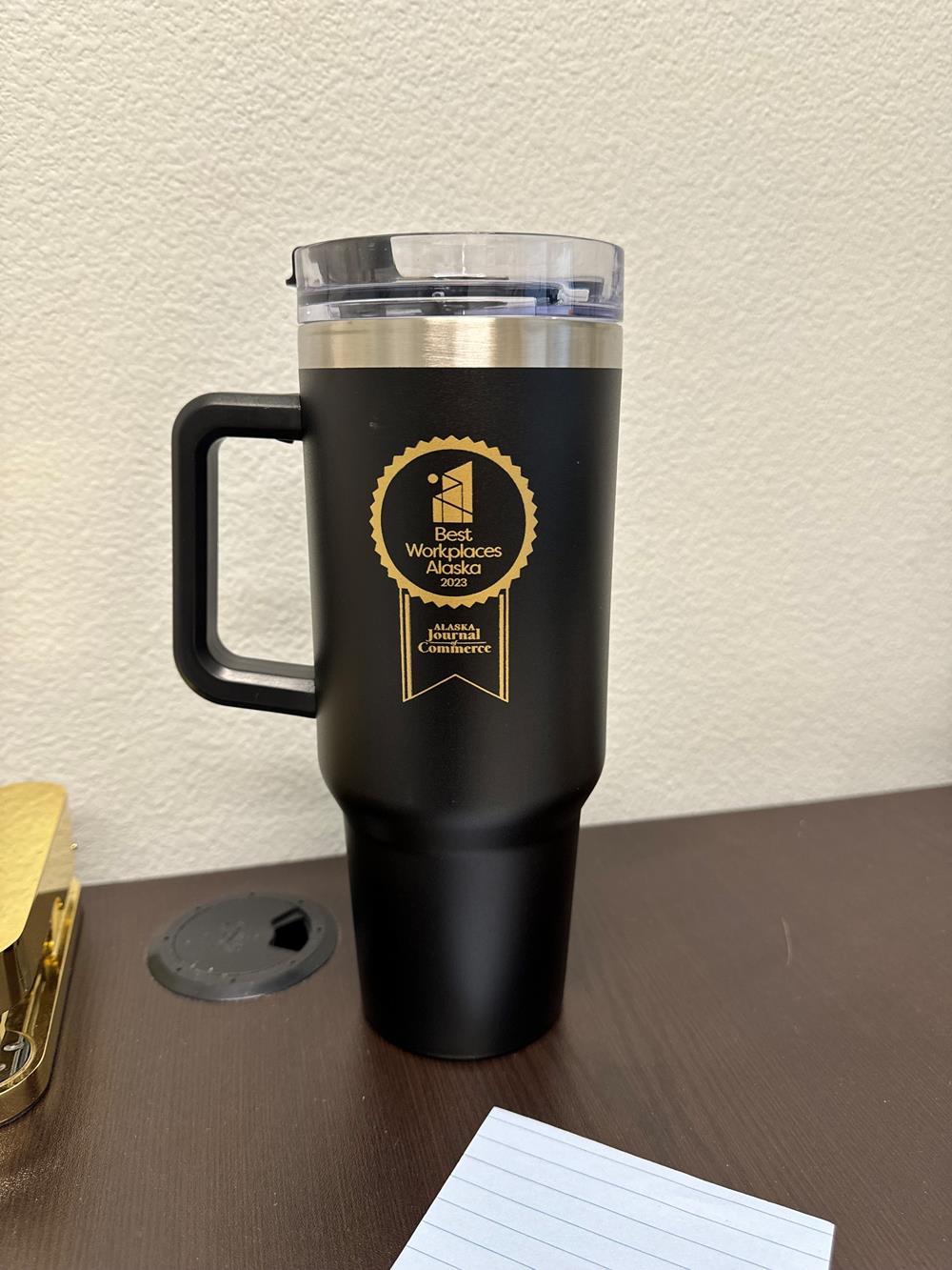 Customer photo from Danielle of our Intrepid Vacuum Mug with Straw - 40 oz., a black and gold coffee mug