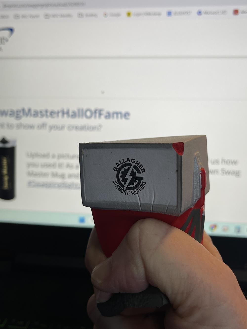 Customer photo from Wendy of our Gas Pump Stress Reliever, a hand holding a toy
