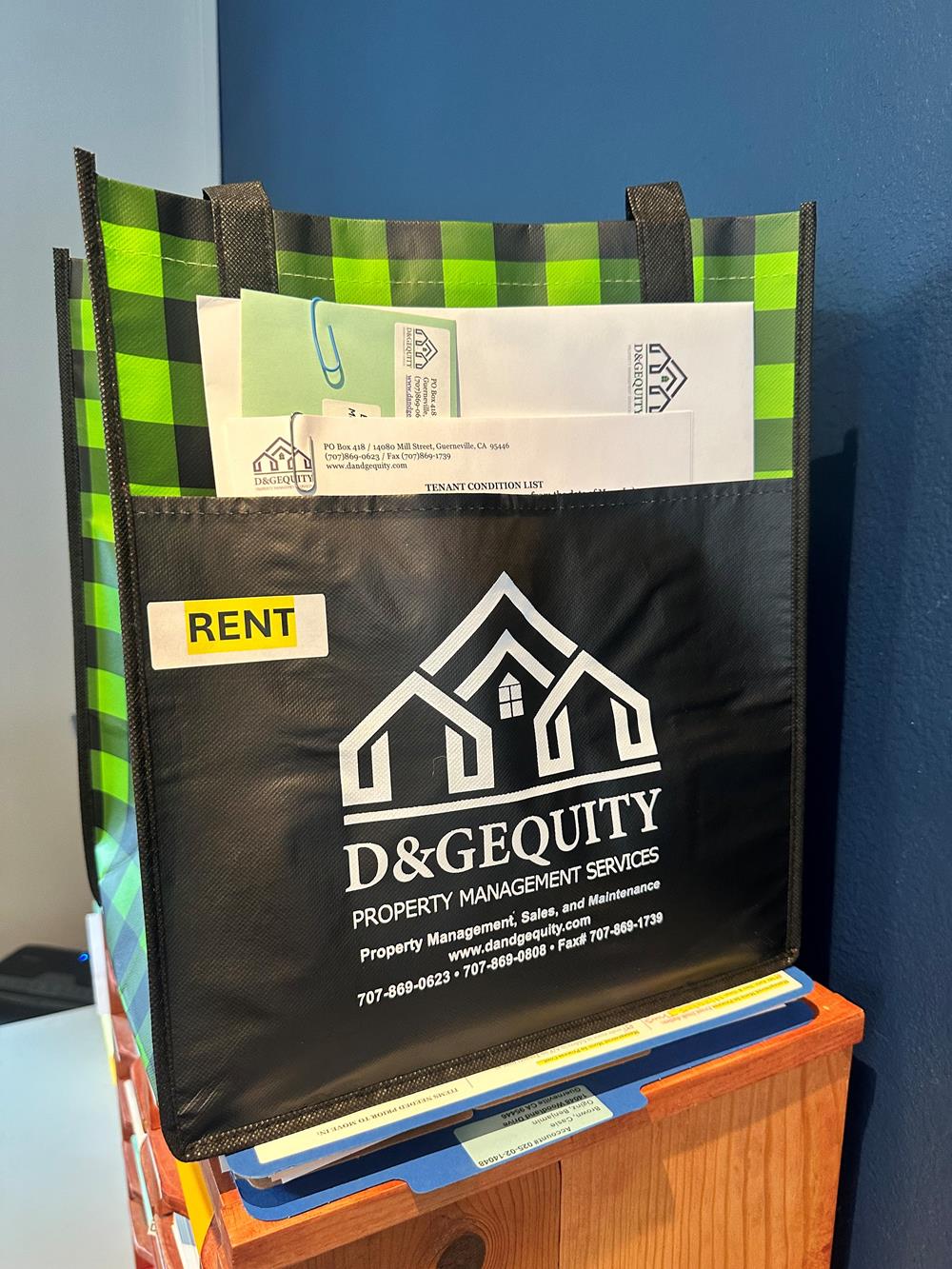 Customer photo from Jill of our Northwoods Plaid Grocery Tote, a bag with a paper and a couple of papers inside