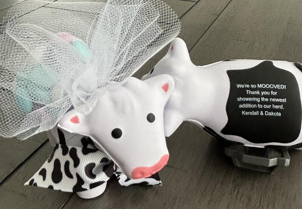 Customer photo from Jeanmarie of our Stress Reliever - Cow, a couple of cow figurines