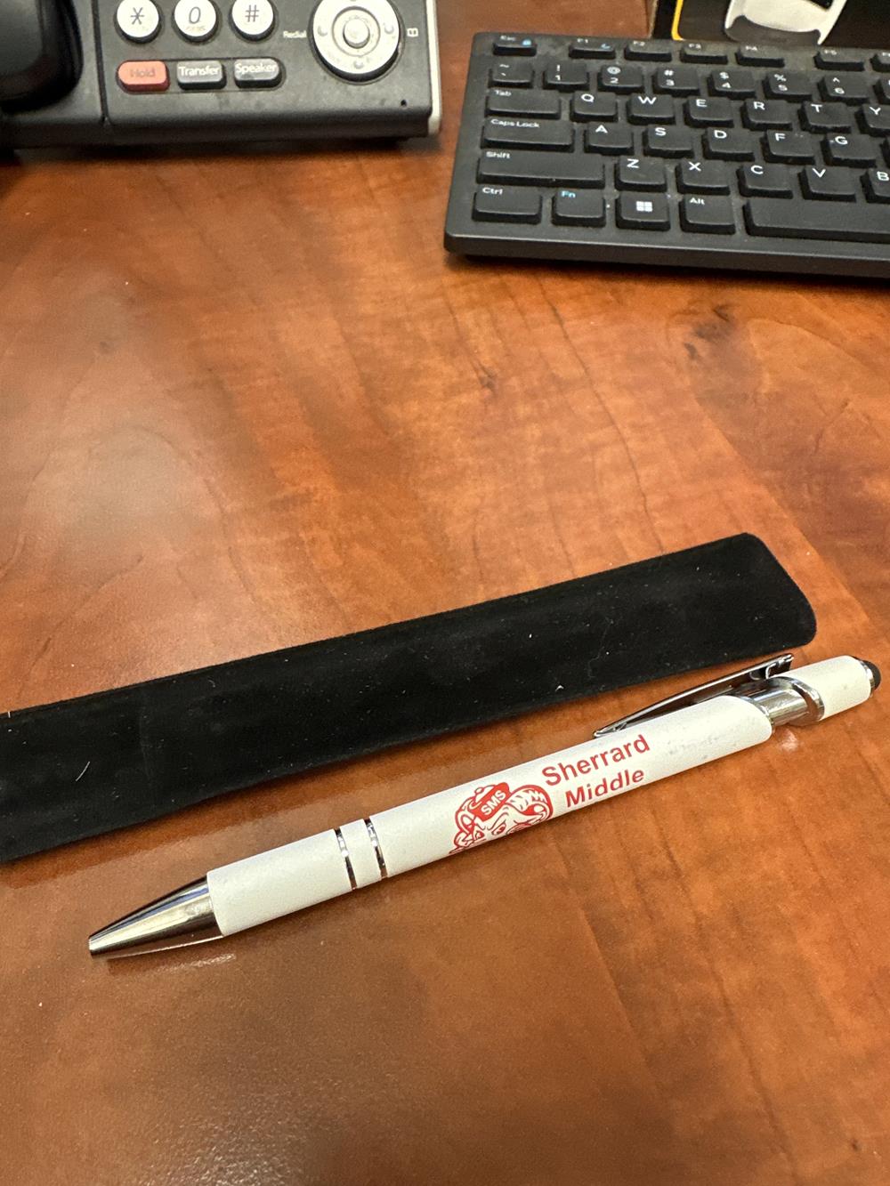 a pen and case on a desk